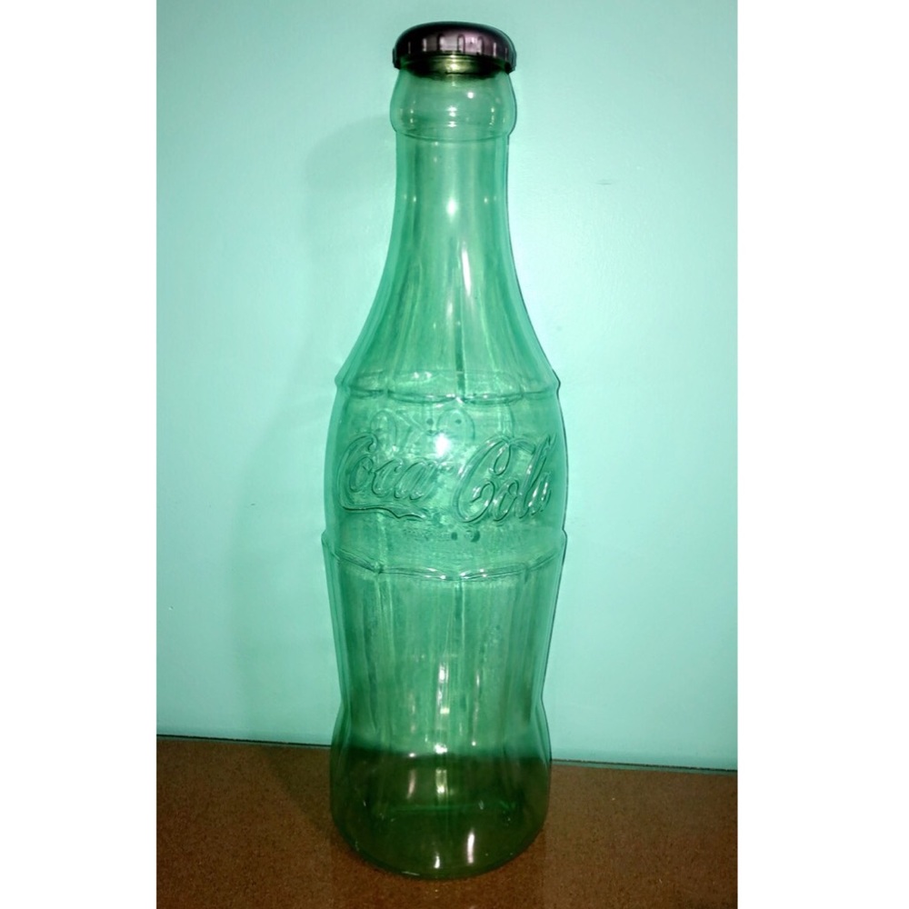 Huge Coca-Cola bottle coin bank